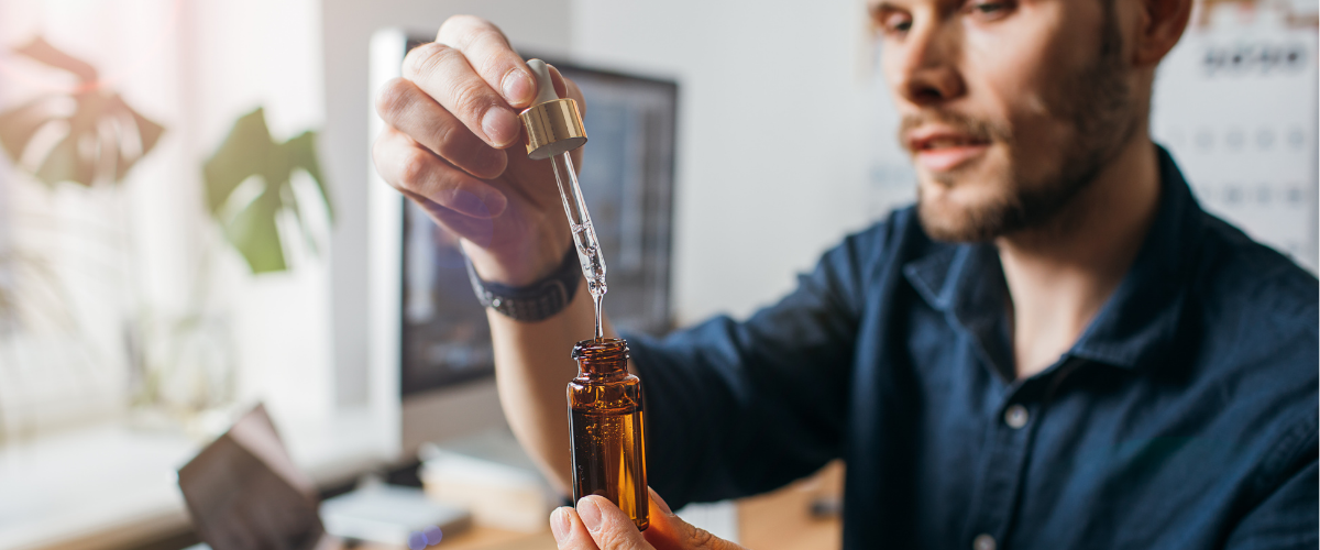 young professional using CBD Oil